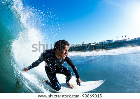 Surfer On Blue Ocean Wave Royalty-Free Stock Photo #90869015