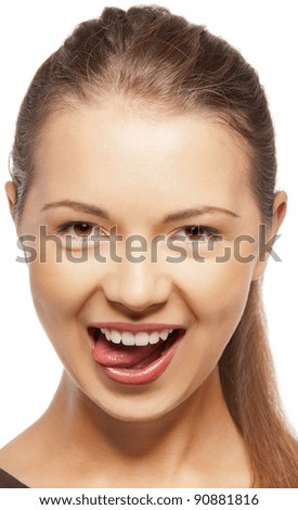 bright closeup portrait picture of teenage girl sticking out her tongue