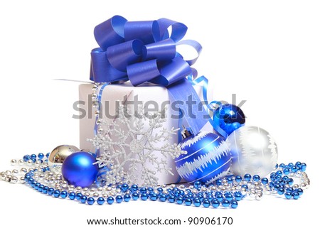 Gift box with Christmas decorations on white background