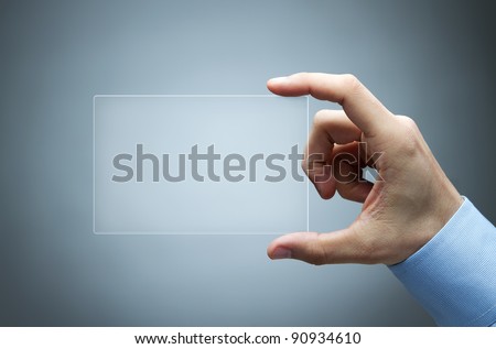 Human hand holding futuristic business card