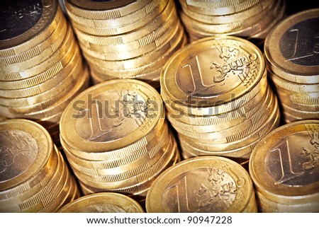 Columns of only one euro coins pieces. Selective focus 02.