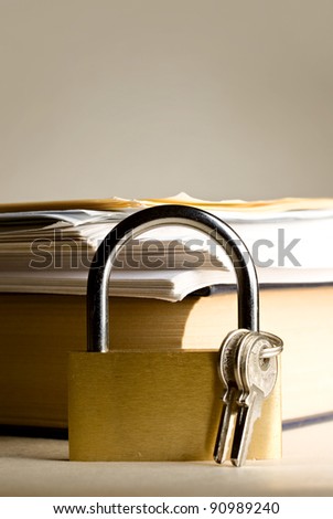 Key lock against the background of paper
