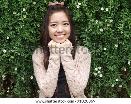 A smile of Asia beautiful girl  on a background of green nature