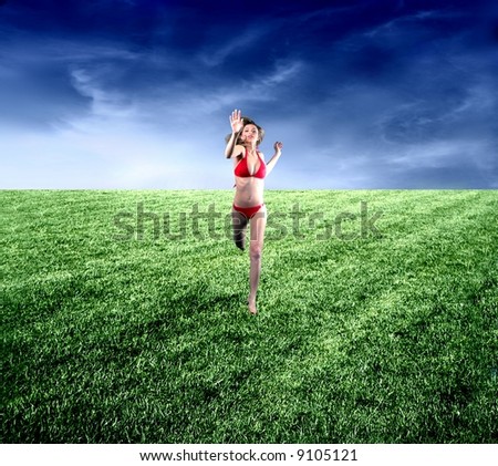 A beautiful girl run on the grassland