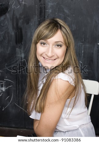 portrait of happy cute student in classroom