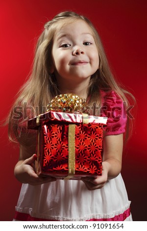 Baby girl with Christmas gift
