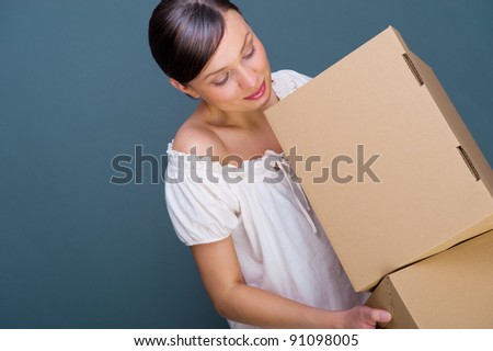 Closeup portrait of a young woman with boxes