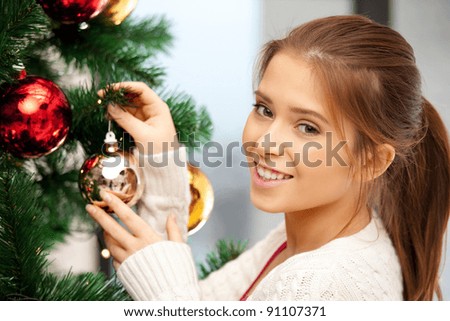 bright picture of woman decorating christmas tree