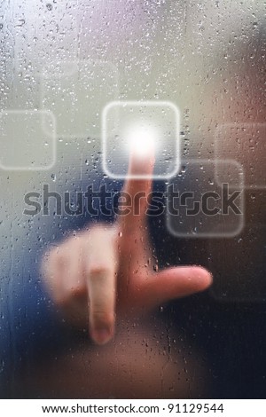 finger on glass and water drop as background