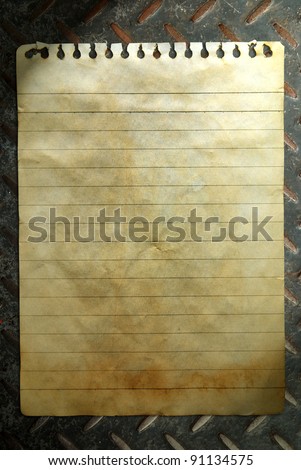 Old notebook paper on wall background