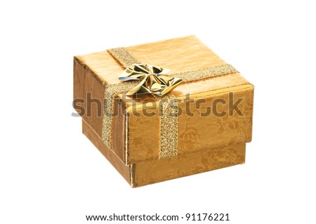 Golden gift box with ribbon and bow on white background