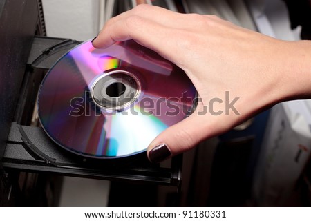 inserting compact disc