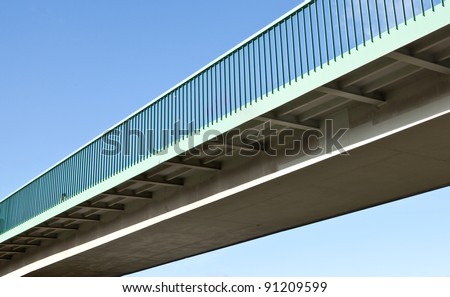 Pedestrian bridge against blue sky Royalty-Free Stock Photo #91209599
