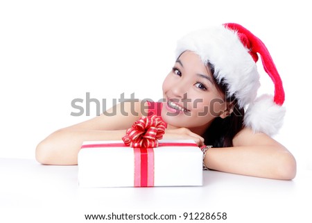 Beautiful Christmas Girl happy holding gift and showing blank billboard isolated on white background, Model is a asian beauty
