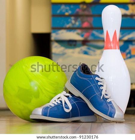Bowling pins, shoes and ball