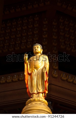 Small golden buddha sculpture