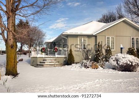 snow covered cottage in winter