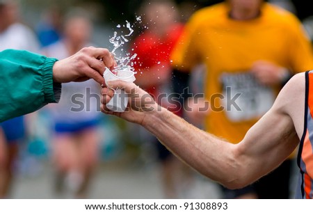 hand give water at foot race Royalty-Free Stock Photo #91308893
