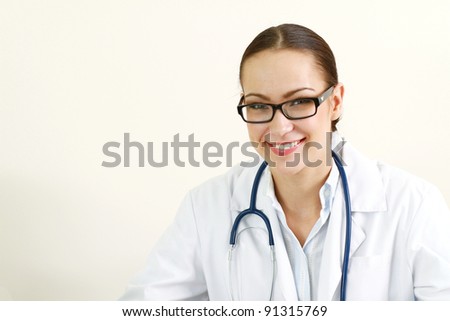 Closeup portrait of a female doctor, isolated on white