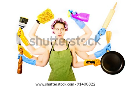 An overworked very busy multitasking housewife under stress Royalty-Free Stock Photo #91400822