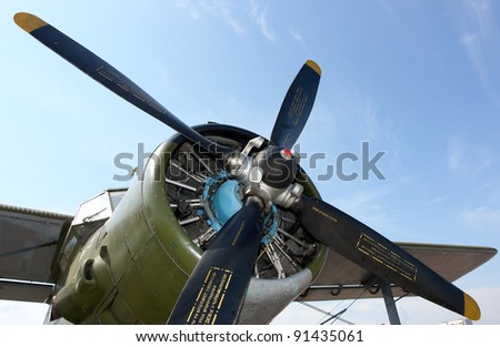 Aircraft propeller against a blue sky Royalty-Free Stock Photo #91435061