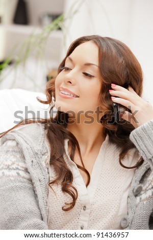 bright picture of woman with cell phone.