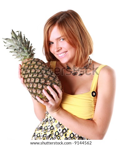 Girl holds really big pineapple, symbol of health