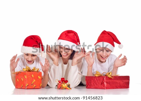 mom and boys in santa hats with gifts