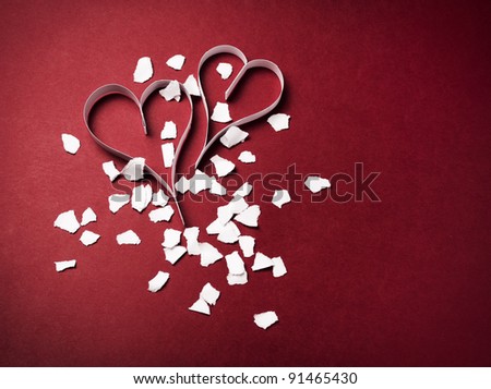 two paper hearts with confetti , on a red background , valentine's day , day valentine