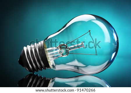 Light bulb on blue background