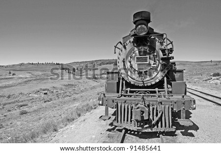 Historic Steam Engine crossing Rocky Mountains between Colorado and and New Mexico.  Converted to black and white from color original