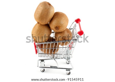 Buying healthy food. Shopping trolley with kiwi on white