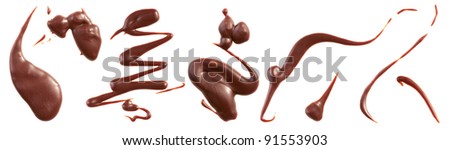 Milk chocolate splashes isolated on white. Royalty-Free Stock Photo #91553903