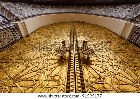 Closeup of ornate carved brass door of palace in Fez, Morocco Royalty-Free Stock Photo #91595177