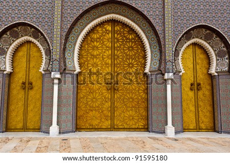 Closeup of 3 Ornate Brass and Tile Doors to Royal Palace in Fez, Morocco Royalty-Free Stock Photo #91595180
