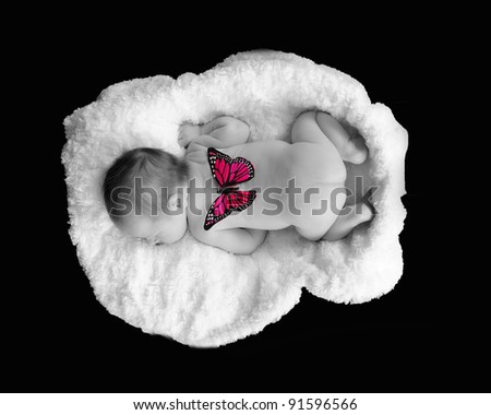 selective image of newborn sleeping with butterfly on back. isolated on black