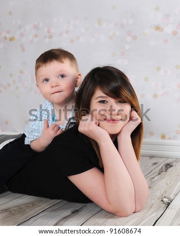 adorable siblings posing together playfully