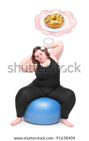 Funny picture of a hungry overweight woman practising with ball. Health care concept.
