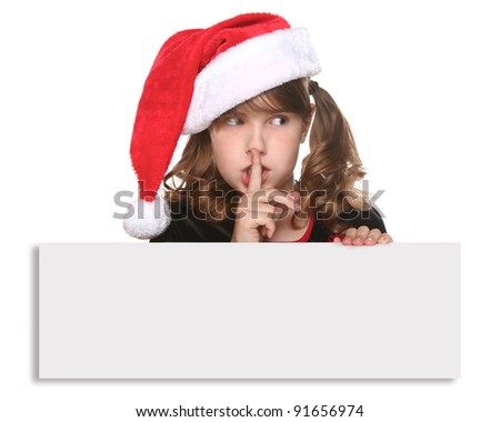 Child in a Christmas Hat With Blank Sign in Hands