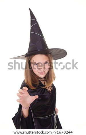 witch in black dress and hat standing