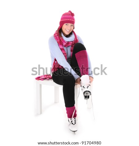 A picture of a young happy woman skiing in the Alps