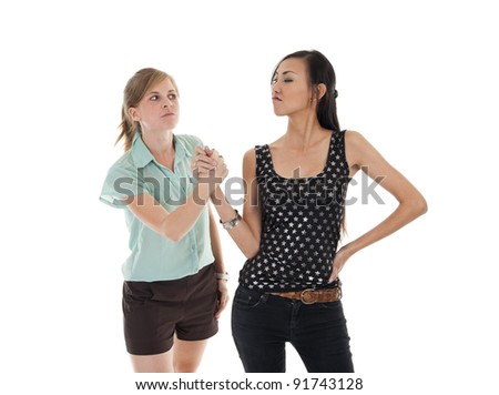 two women shaking hand without being happy, isolated on white background Royalty-Free Stock Photo #91743128