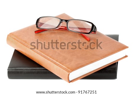 Study. Books stack with eyeglass on the white background