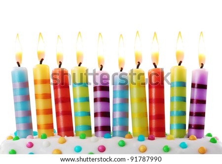 Ten birthday candles on white background