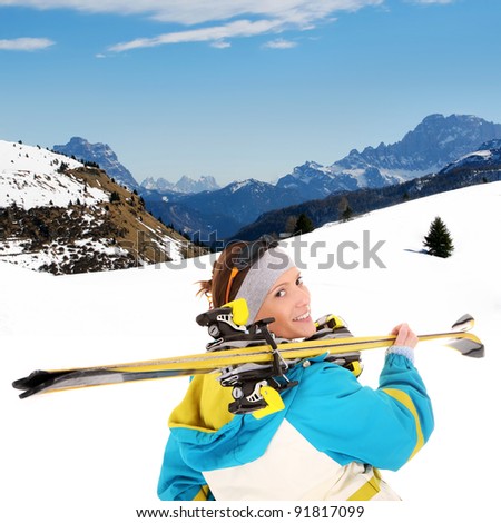 A picture of a young female skier enjoying snow in the Alps