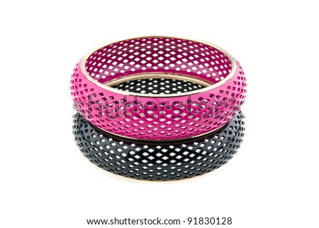Black and pink bracelet placed on white