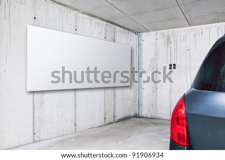 Blank white advertisement board on the wall in public parking area space
