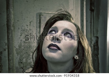 emo girl with beautiful hair on  Grunge background