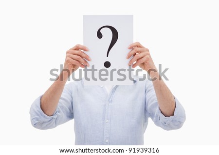 Portrait of a man hiding his face behind a question mark against a white background Royalty-Free Stock Photo #91939316