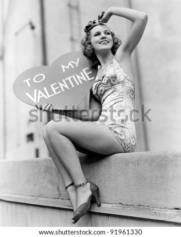 Woman holding a large valentine